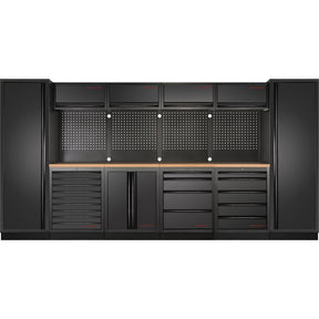 Large professional workshop cabinet system with pegboard tool wall, multiple drawers, and wooden worktop for garage organization, available at Tools.de